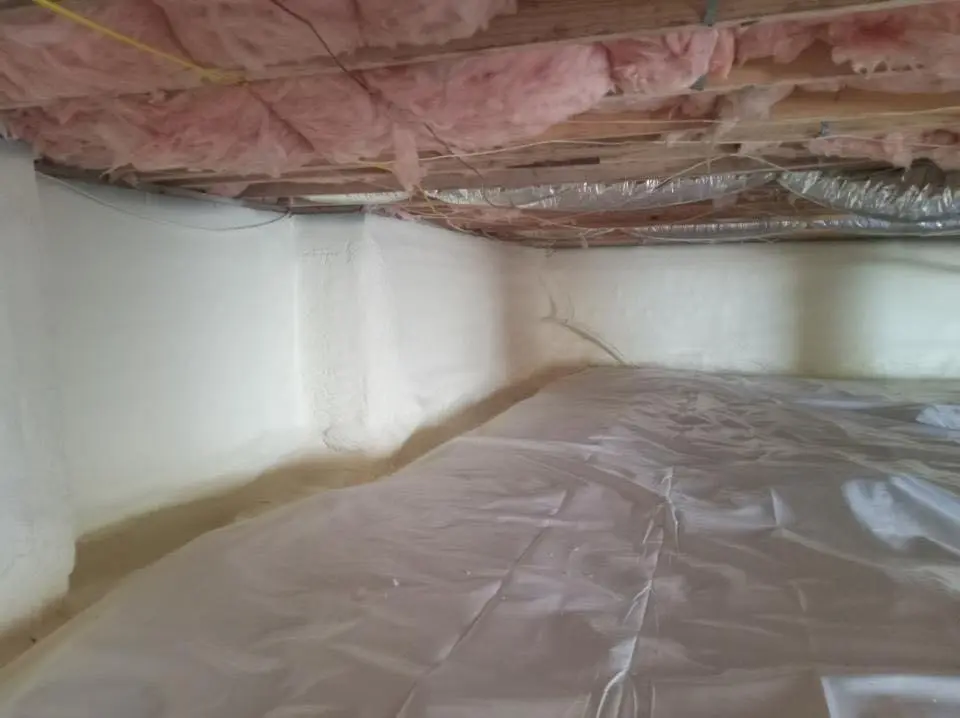 Crawl space encapsulation with closed-cell spray foam for Commercial Roof Restoration in Covington